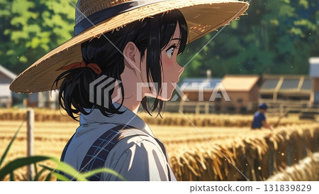 Woman wearing a straw hat working on a farm 131839829