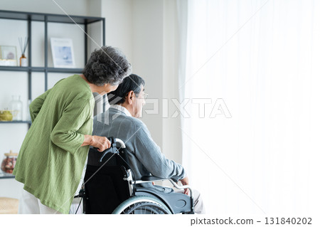 Senior couple in wheelchairs Senior couple in wheelchairs 131840202