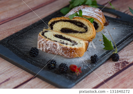 Homemade bun with poppy seed filling close-up 131840272