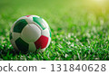 Italy Flag of a new soccer ball in green grass with copy space. 131840628
