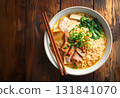 Ramen noodle soup with pork, egg, and green onion topping 131841070