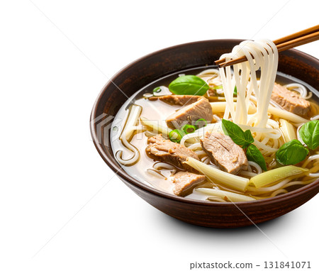Vietnamese pho beef noodle soup with chopsticks lifting noodles Vietnamese pho beef noodle soup with chopsticks lifting noodles 131841071