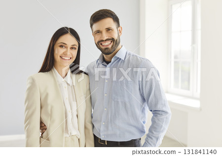 Happy Married Couple Smiling Together In Their New Home Happy Married Couple Smiling Together In Their New Home 131841140