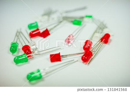 Red and green LED diodes macro on white background electronic components and technology concept Red and green LED diodes macro on white background electronic components and technology concept 131841568
