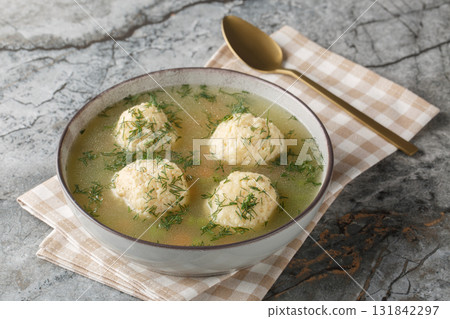 Matzah Ball Soup for Passover closeup on the plate. Horizontal 131842297