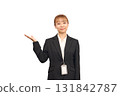 A woman in a business suit posing as if saying "please" 131842787