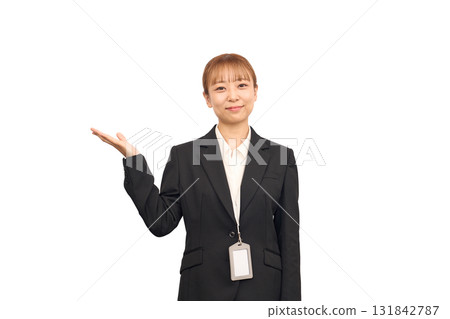A woman in a business suit posing as if saying "please" 131842787