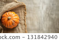 Halloween and thanksgiving pumpkins with rustic fabric. Craft, cozy minimalist background. 131842940