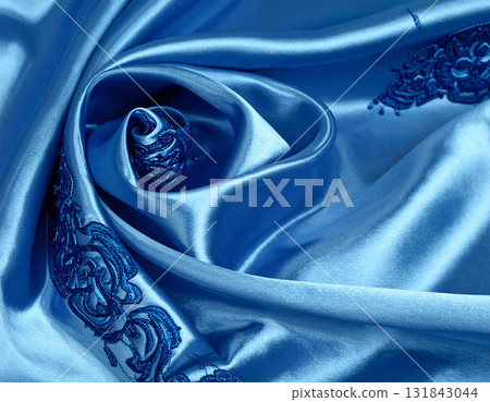 A gorgeous blue silk drape with blue embroidery. 131843044