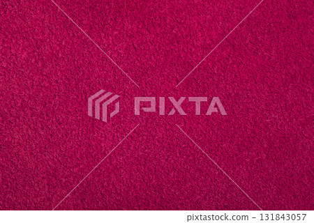 Dark pink suede. Texture of natural suede. Background of suede leather of crimson color. 131843057