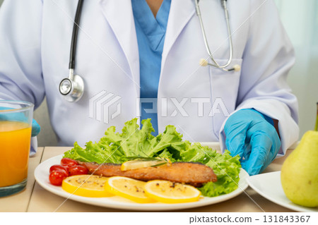 Asian Nutritionist holding healthy food for patient in hospital, nutrition and vitamin. 131843367