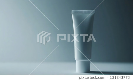 Minimalist Cosmetic Tube Standing Upright Against Blue Gradient Background Minimalist Cosmetic Tube Standing Upright Against Blue Gradient Background 131843773