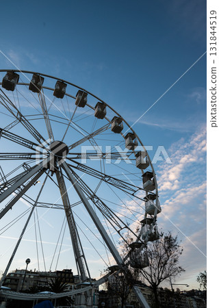 A specially erected white Ferris wheel in the city at sunrise in San Sebastian, Spain A specially erected white Ferris wheel in the city at sunrise in San Sebastian, Spain 131844519