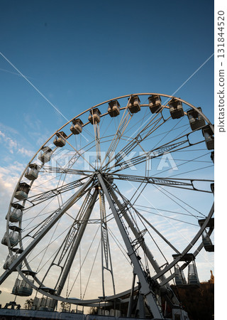 A specially erected white Ferris wheel in the city at sunrise in San Sebastian, Spain A specially erected white Ferris wheel in the city at sunrise in San Sebastian, Spain 131844520