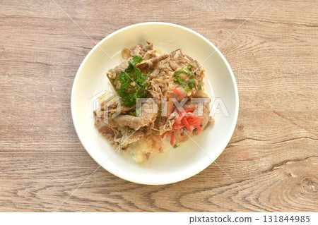 pork yakiniku or barbecue meat topping rice with slice red pickled ginger on plate 131844985