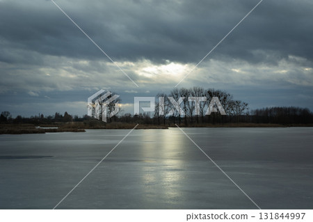 Stormy clouds over the frozen lake 131844997