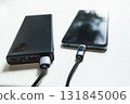 Smartphone connected to a power bank 131845006