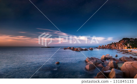 AI-generated image of a starry sky over a midnight beach and a quiet island floating on the horizon AI-generated image of a starry sky over a midnight beach and a quiet island floating on the horizon 131845133