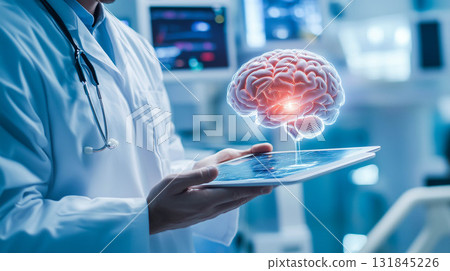 Doctor holding tablet with human brain model. 131845226