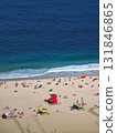 View to the city beach with lots of people sunbathing and swimming. 131846865