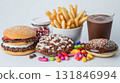 Junk food on white table. Fast carbohydrates not good for health. 131846994