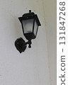 Vintage black lantern on a white wall 131847268