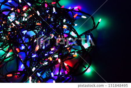 Pattern of Twisted Cables of Glowing LED Garland Close Up View Stock Photo Pattern of Twisted Cables of Glowing LED Garland Close Up View Stock Photo 131848495
