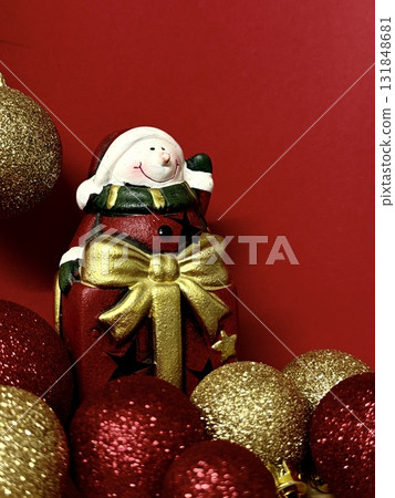 Close-up shot of Christmas tree decorations against a red background. New Year's and Christmas background. 131848681
