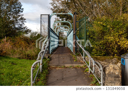 Pedestrian Footbridge Over the River Allan at Bridge of Allan Scotalnd in Autumn 131849038