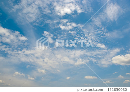 Expansive Clear Blue Sky With Scattered White Cumulus and Cirrus Clouds Horizontal 131850080