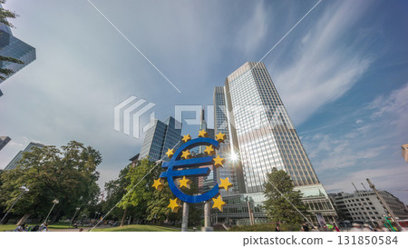 Timelapse hyperlapse of the Euro currency sign in downtown Frankfurt near the former headquarters of the European Central Bank. Germany Timelapse hyperlapse of the Euro currency sign in downtown Frankfurt near the former headquarters of the European Central Bank. Germany 131850584