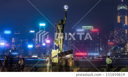 Bronze statue of Hong Kong Film Awards and skyline in Avenue of Stars timelapse hyperlapse. Bronze statue of Hong Kong Film Awards and skyline in Avenue of Stars timelapse hyperlapse. 131850614