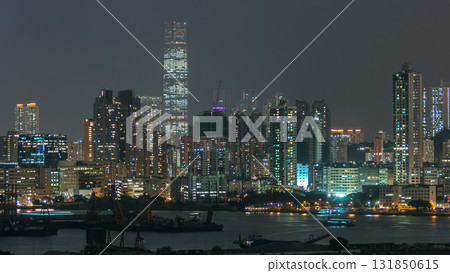 Top view of Hong Kong at night, aerial view from Kowloon bay downtown timelapse Top view of Hong Kong at night, aerial view from Kowloon bay downtown timelapse 131850615