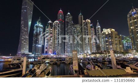 Dubai Marina with tallest skyscrapers and boats night timelapse hyperlapse 131850660