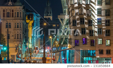 Traffic on the street near Dancing house in Prague timelapse, Czech republic. Modern architecture. 131850664