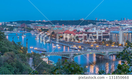 Aerial evening view of the Vltava River and illuminated bridges day to night timelapse, Prague 131850668