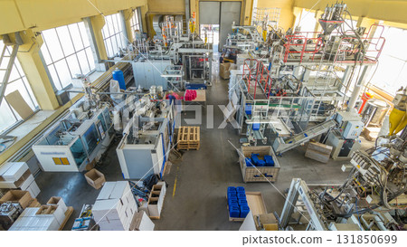 A factory for plastic canister production timelapse hyperlapse. The conveyor in the factory. A factory for plastic canister production timelapse hyperlapse. The conveyor in the factory. 131850699