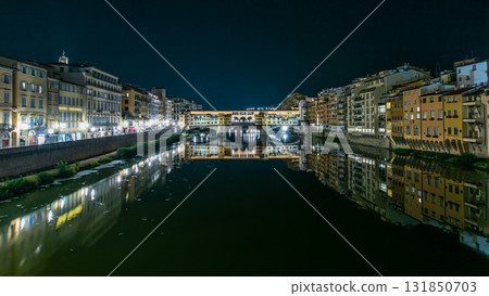 Famous Ponte Vecchio bridge timelapse over the Arno river in Florence, Italy, lit up at night Famous Ponte Vecchio bridge timelapse over the Arno river in Florence, Italy, lit up at night 131850703