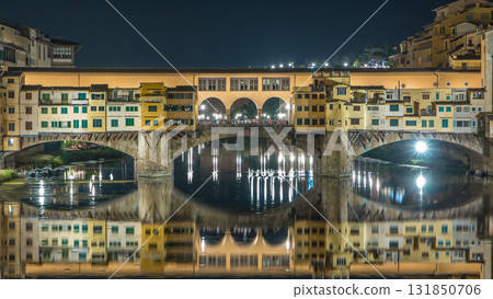 Famous Ponte Vecchio bridge timelapse over the Arno river in Florence, Italy, lit up at night Famous Ponte Vecchio bridge timelapse over the Arno river in Florence, Italy, lit up at night 131850706