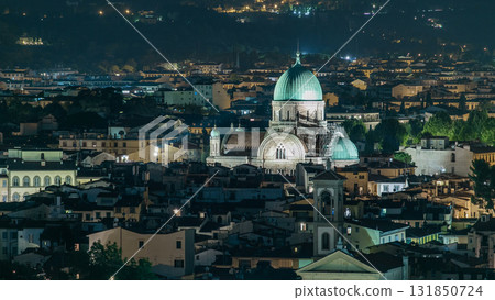 Synagogue of Florence night timelapse with green copper dome rising above surrounding suburban housing 131850724