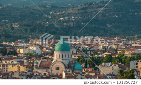 Synagogue of Florence timelapse with green copper dome rising above surrounding suburban housing with green hillside 131850727