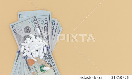 Pills and Money Healthcare Costs Concept. Isolated on a Beige Background. Modern Medicine 131850776