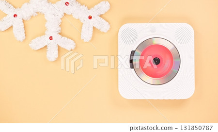 Modern White CD Player with Festive Decoration on Beige Background, Minimalist Style 131850787