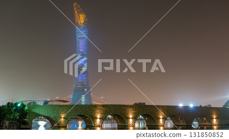 The Aspire Tower or Torch Hotel timelapse in Doha Sports City at night. Doha, Qatar, Middle East 131850852