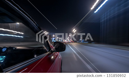 Drivelapse urban look from fast driving car at a night avenue in a city timelapse hyperlapse Drivelapse urban look from fast driving car at a night avenue in a city timelapse hyperlapse 131850932
