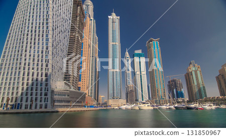 Dubai Marina with tallest skyscrapers and boats timelapse hyperlapse 131850967