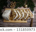 Traditional Sharden Christmas cake cut into slices on a festive table  131850973