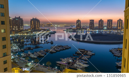 Evening at the Pearl-Qatar day to night timelapse from top. Evening at the Pearl-Qatar day to night timelapse from top. 131850985