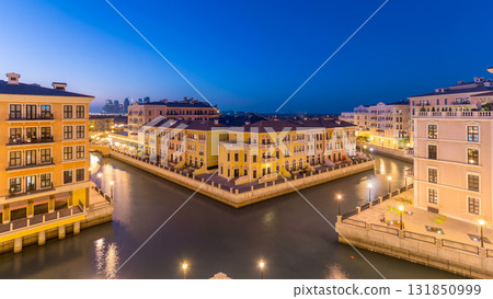 Canal aerial top view in Venice-like Qanat Quartier of the Pearl precinct of Doha day to night timelapse, Qatar. Canal aerial top view in Venice-like Qanat Quartier of the Pearl precinct of Doha day to night timelapse, Qatar. 131850999