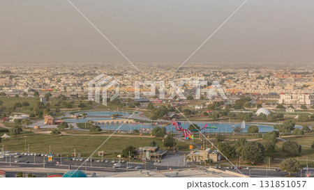 Bridge with fountain and lake in the Aspire park timelapse in Doha, Qatar Bridge with fountain and lake in the Aspire park timelapse in Doha, Qatar 131851057